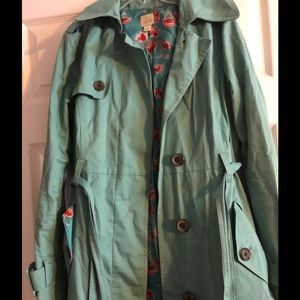 Teal trench coat with bow detail on back
